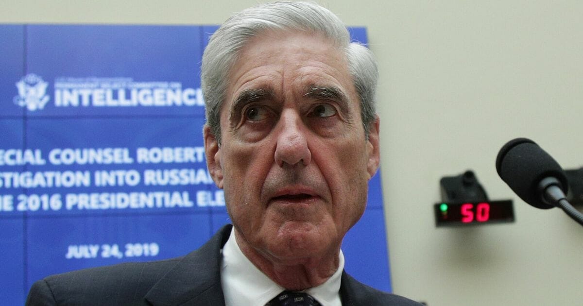 Former special counsel Robert Mueller waits to testify before the House Intelligence Committee about his report on Russian interference in the 2016 presidential election July 24, 2019, in the Rayburn House Office Building in Washington