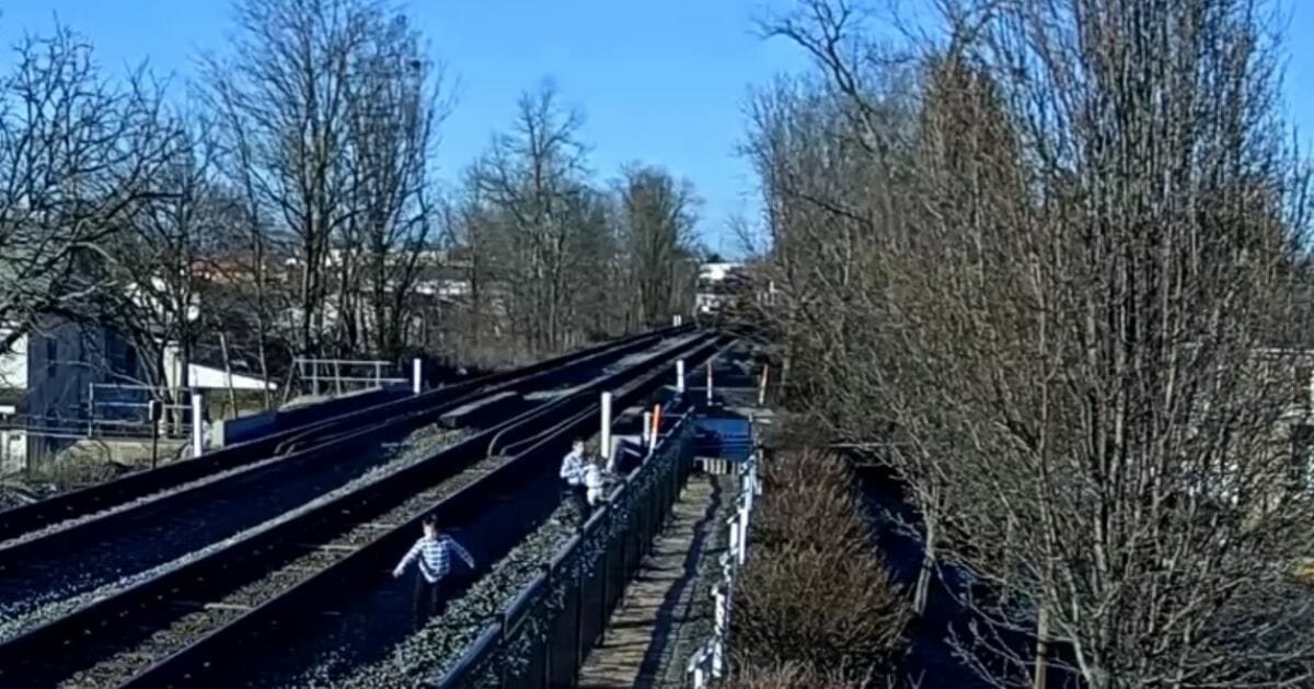 A family in Greencastle, Pennsylvania, runs out of the path of an oncoming train.