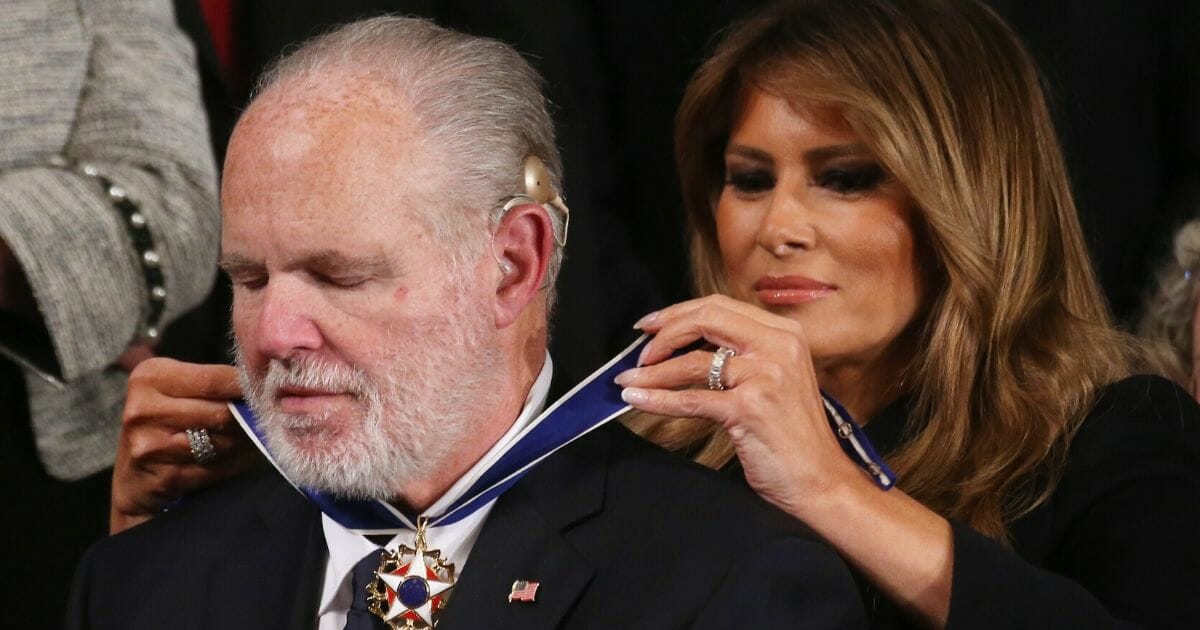 Radio personality Rush Limbaugh reacts as first lady Melania Trump gives him the Presidential Medal of Freedom during the State of the Union address in the chamber of the House of Representatives on Feb. 4, 2020, in Washington, D.C.