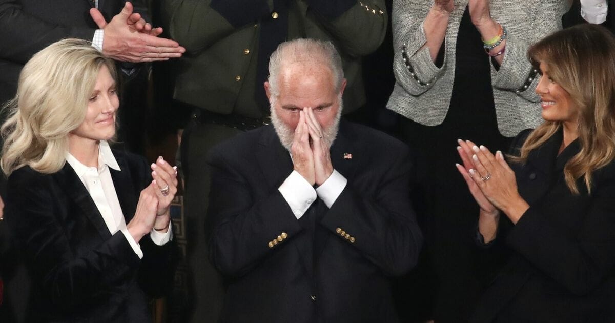 Rush Limbaugh reacts after President Donald Trump announced during the State of the Union address on Feb. 4, 2020, that the radio legend would receive the Presidential Medal of Freedom. Limbaugh's wife, Kathryn, left, and first lady Melania Trump, right, joined in the applause in the chamber of the U.S. House of Representatives.