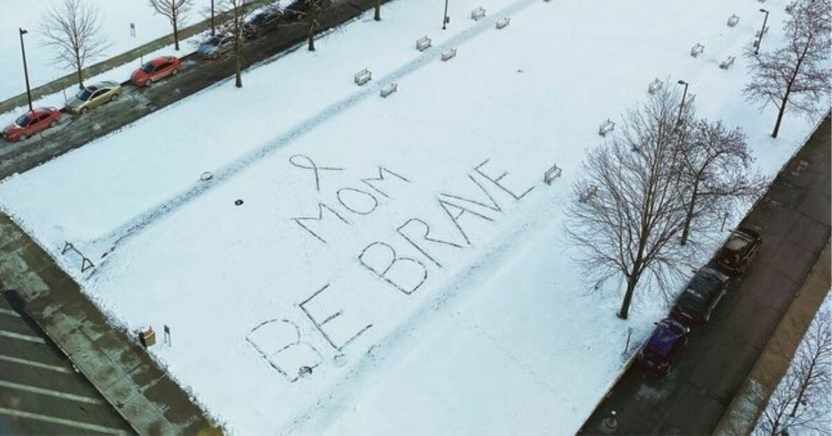 Marie Schambach wrote this message in the snow for her mother, Michele, who is battling advanced brain cancer.