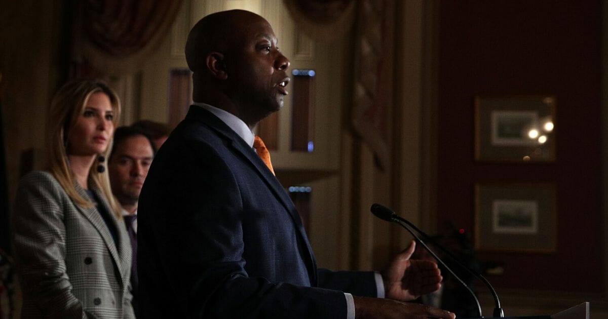 Sen. Tim Scott, a Republican from South Carolina, speaks as Ivanka Trump looks on during a news conference Oct. 25, 2017, at the Capitol in Washington, D.C.