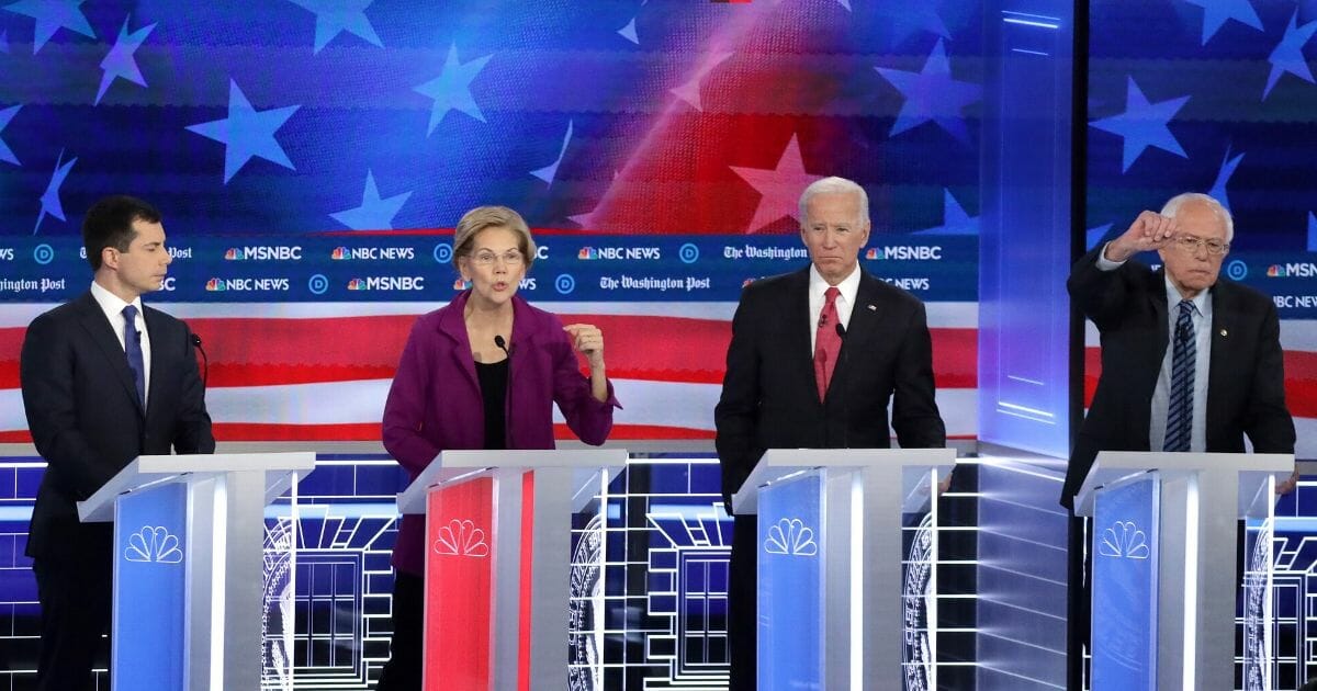 The top candidates listen during the Democratic presidential debate at Tyler Perry Studios on Nov. 20, 2019, in Atlanta, Georgia.