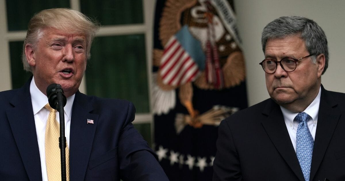 President Donald Trump makes a statement alongside Attorney General William Barr in the Rose Garden of the White House on July 11, 2019.