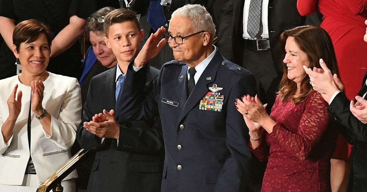 Retired Air Force Col. Charles McGee salutes as President Donald Trump honors him during the State of the Union address at the U.S. Capitol in Washington on Feb. 4, 2020.