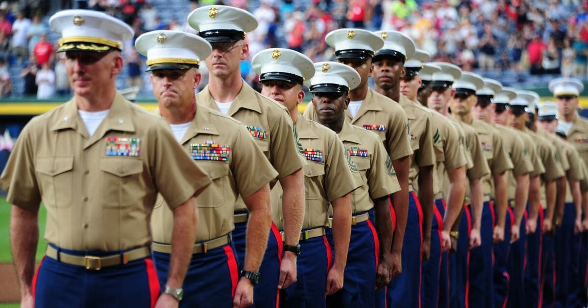 Members of the United States Marine Corps stand at attention