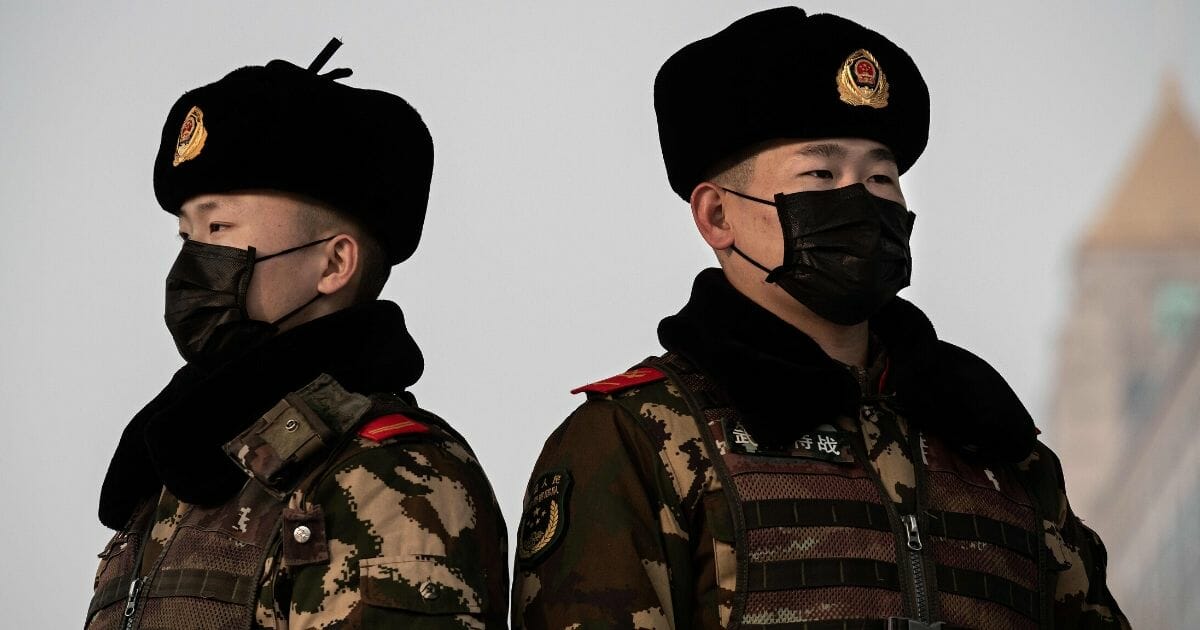 Chinese guards stand watch in Beijing.