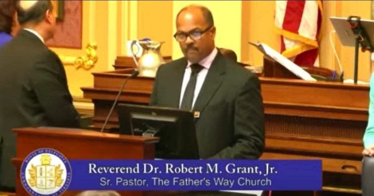 Rev. Dr. Robert M. Grant Jr. giving the opening prayer in Virginia's House of Delegates.