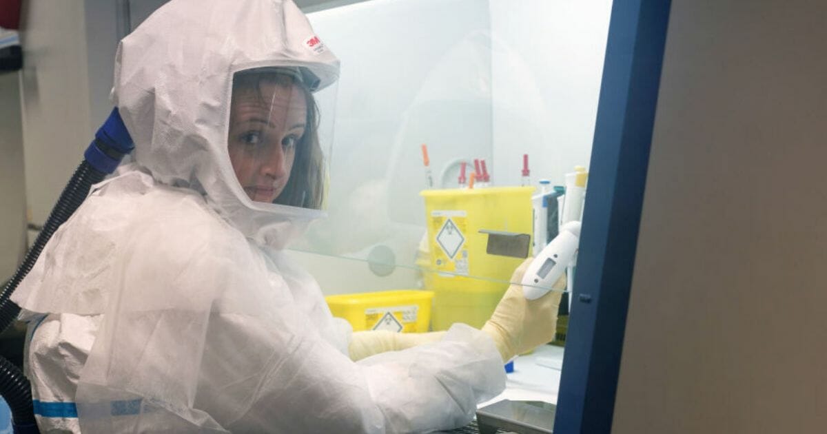A virologist works in a biolab during the COVID-19 outbreak