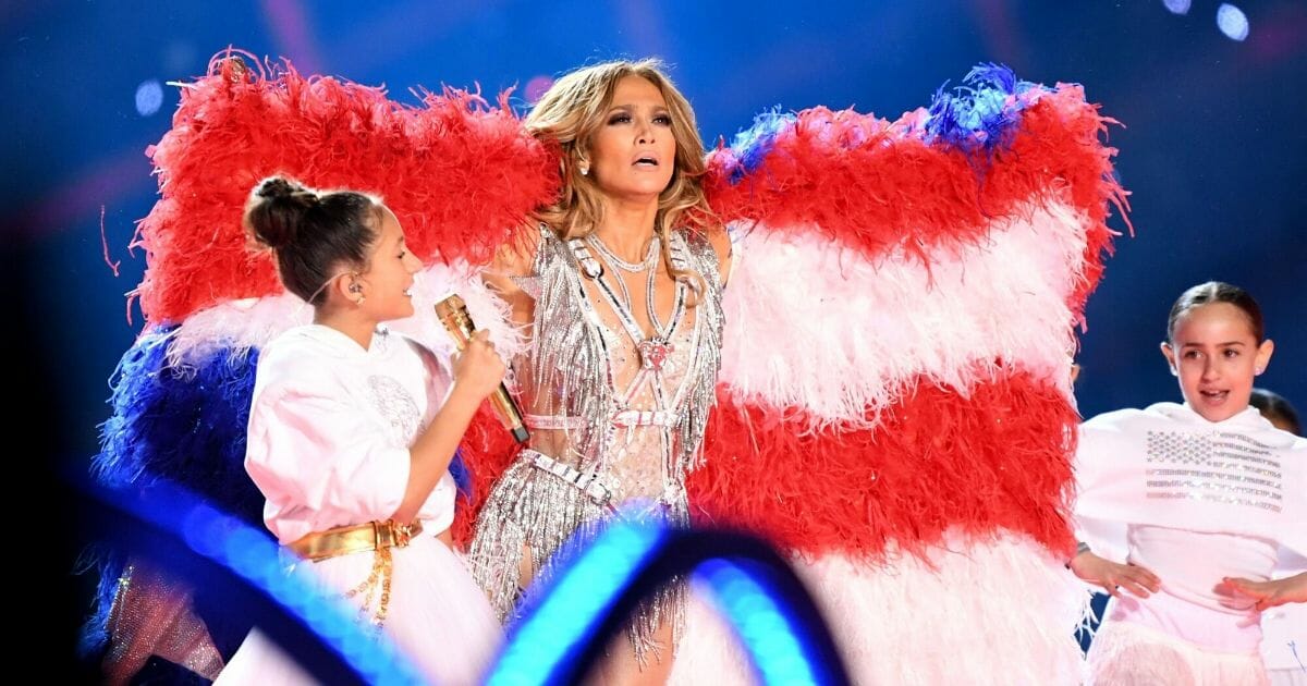 Singer Jennifer Lopez performs with her daughter, 11-year-old Emme Maribel Muñiz, during the Pepsi Super Bowl LIV Halftime Show at Hard Rock Stadium in Miami on Sunday.