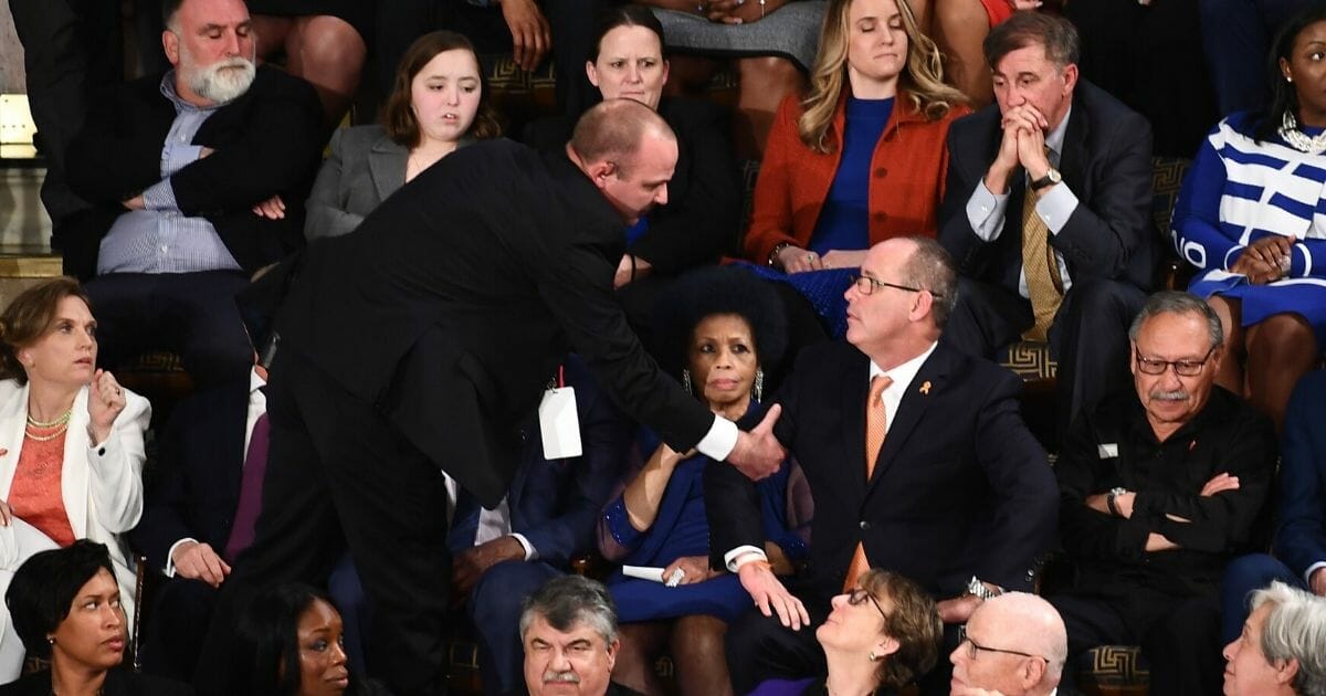 Fred Guttenberg, father of a victim of the 2018 Parkland, Florida, mass shooting, is removed from the State of the Union speech after an outburst Tuesday night.