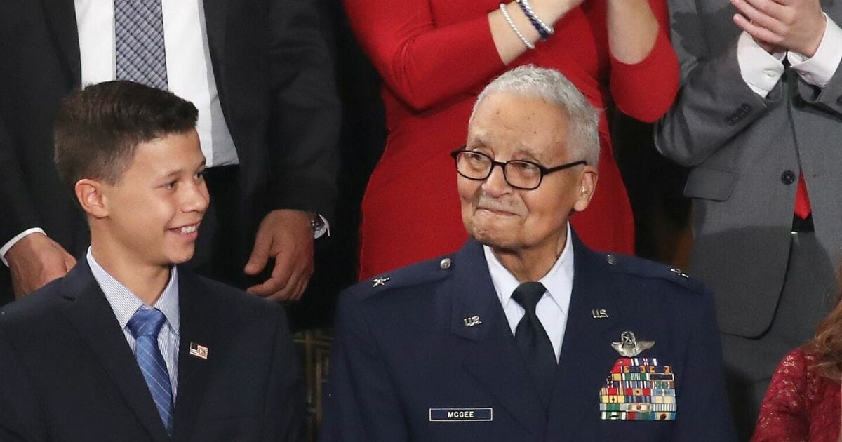 Retired U.S. Air Force Brig. Gen. Charles McGee, who served with the Tuskegee Airmen, attends the State of the Union address with his great-grandson Iain Lanphier in the chamber of the U.S. House of Representatives on Feb. 4, 2020, in Washington, D.C.