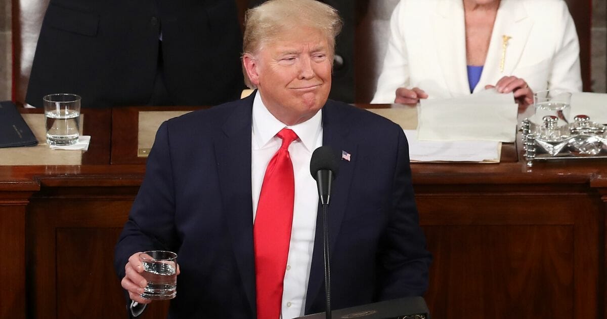 President Donald Trump holds a glass of water during the State of the Union address in the chamber of the U.S. House of Representatives on Feb. 4, 2020, in Washington, D.C.