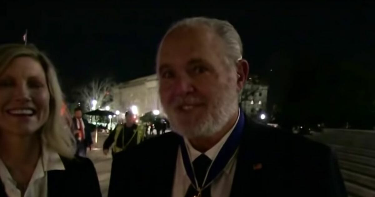 Conservative radio host Rush Limbaugh talks to a reporter following the State of the Union Address at which he was awarded the Presidential Medal of Freedom.
