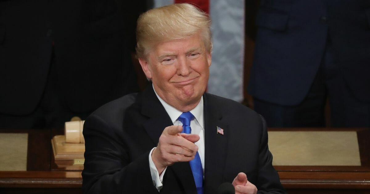 President Donald Trump points to his audience during his first State of the Union address to Congress in 2018.