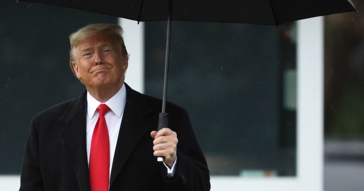 President Donald Trump smiles as he walks toward Marine One on the South Lawn prior to his departure from the White House on Feb. 10, 2020, in Washington, D.C.