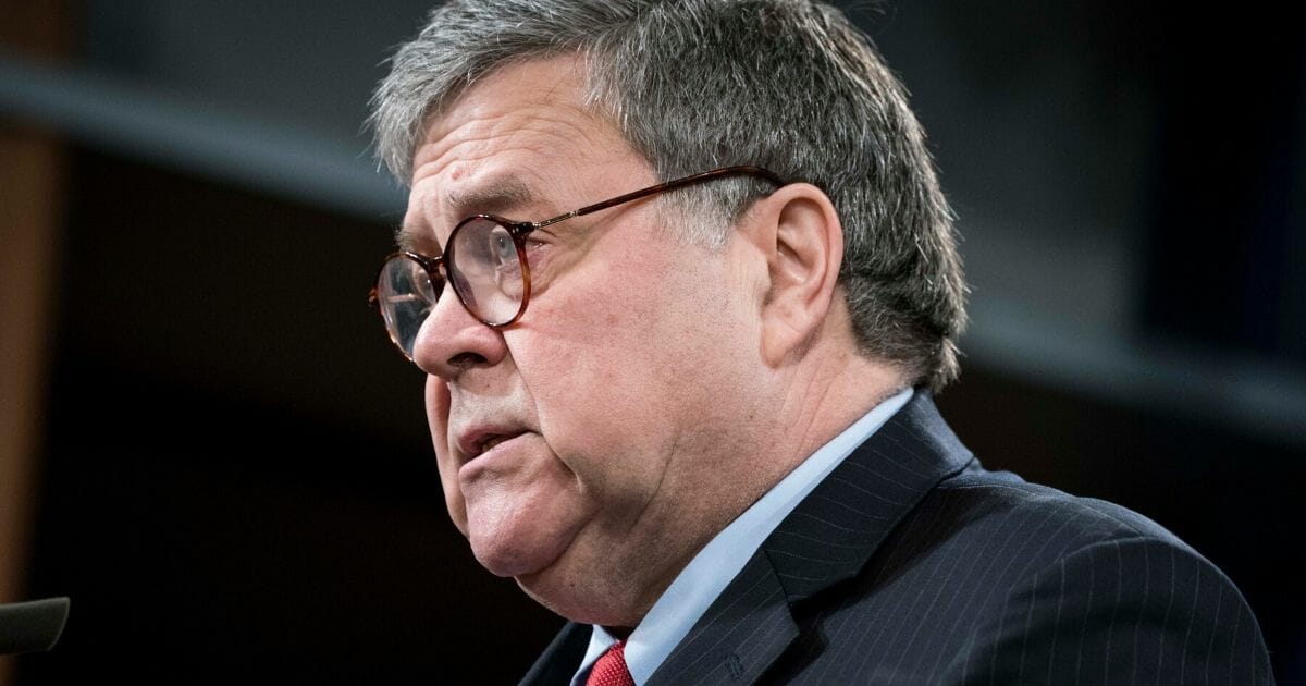 Attorney General William Barr participates in a news conference at the Department of Justice along with DOJ officials on Feb. 10, 2020, in Washington, D.C.