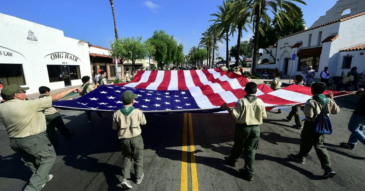 A Boy Scout troop carries the flag during a July 4 parade in San Gabriel, California, in 2018.