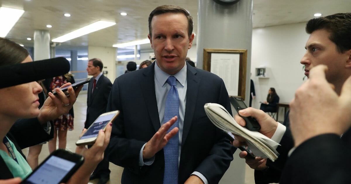Connecticut Sen. Chris Murphy meets with reporters on Capitol Hill in September.