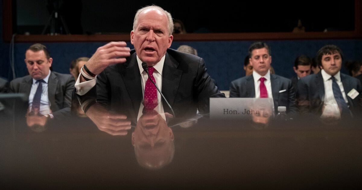 Former CIA Director John Brennan testifies before the House Permanent Select Committee on Intelligence on Capitol Hill in May 2017 about Russian meddling in the 2016 presidential election.