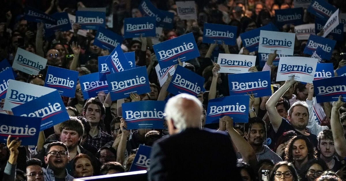 Vermont Sen. Bernie Sanders is greeted by a sea of "Bernie" signs Saturday in San Antonio, Texas, after a dominating victory in the Nevada caucuses.