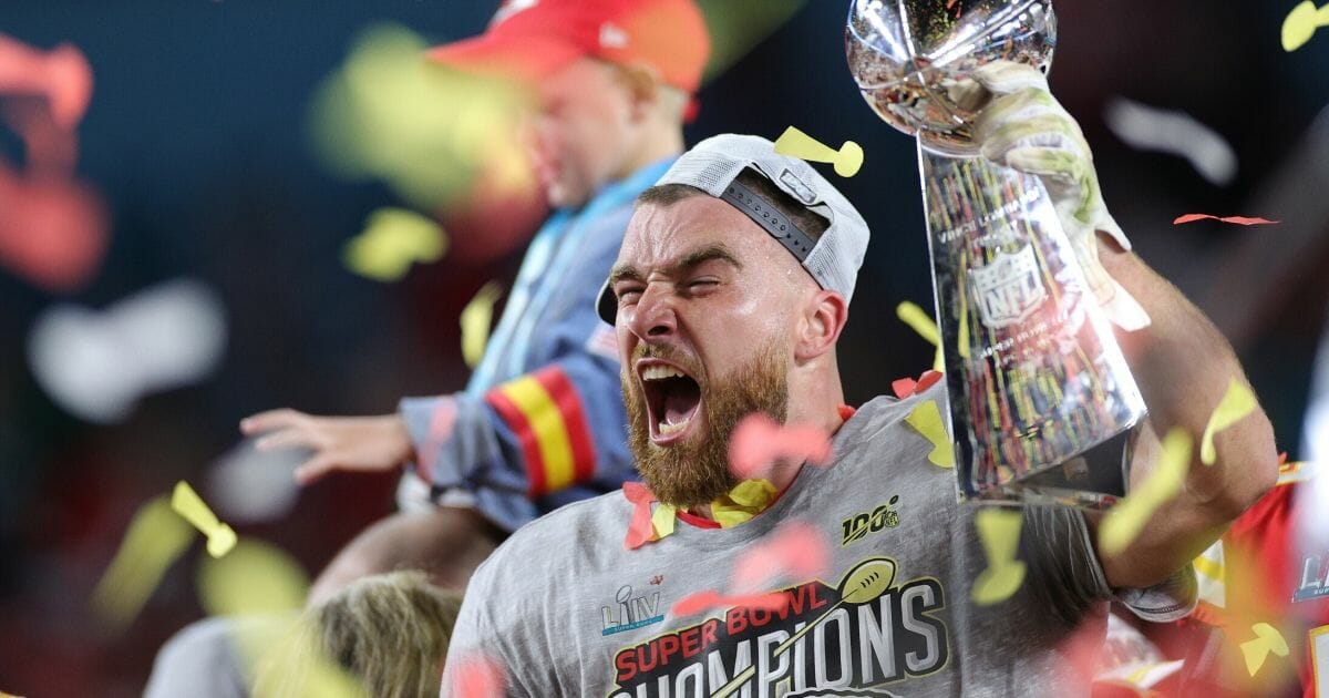 Travis Kelce of the Kansas City Chiefs celebrates with the Vince Lombardi Trophy after defeating the San Francisco 49ers 31-20 in Super Bowl LIV at Hard Rock Stadium on Feb. 2, 2020, in Miami.