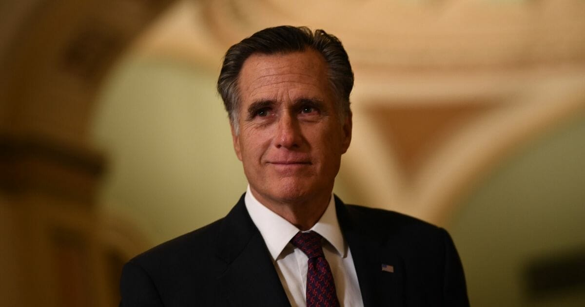 Republican Sen. Mitt Romney of Utah walks outside the Senate chamber during a recess in the impeachment trial against President Donald Trump at the U.S. Capitol on Jan. 28, 2020, in Washington, D.C.