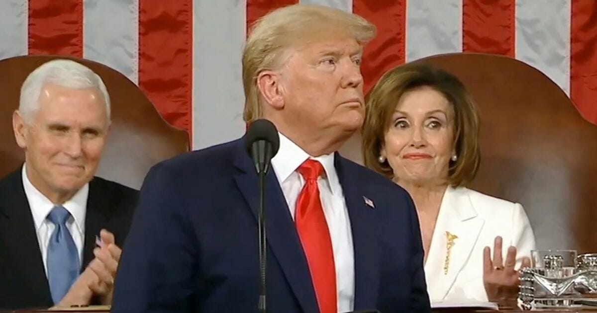 House Speaker Nancy Pelosi claps as President Donald Trump speaks during his State of the Union address.