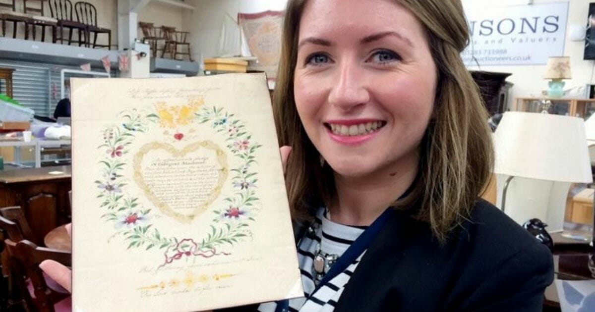 Hansons valuer Isabel Murtough holds one of the oldest and rarest Valentines.