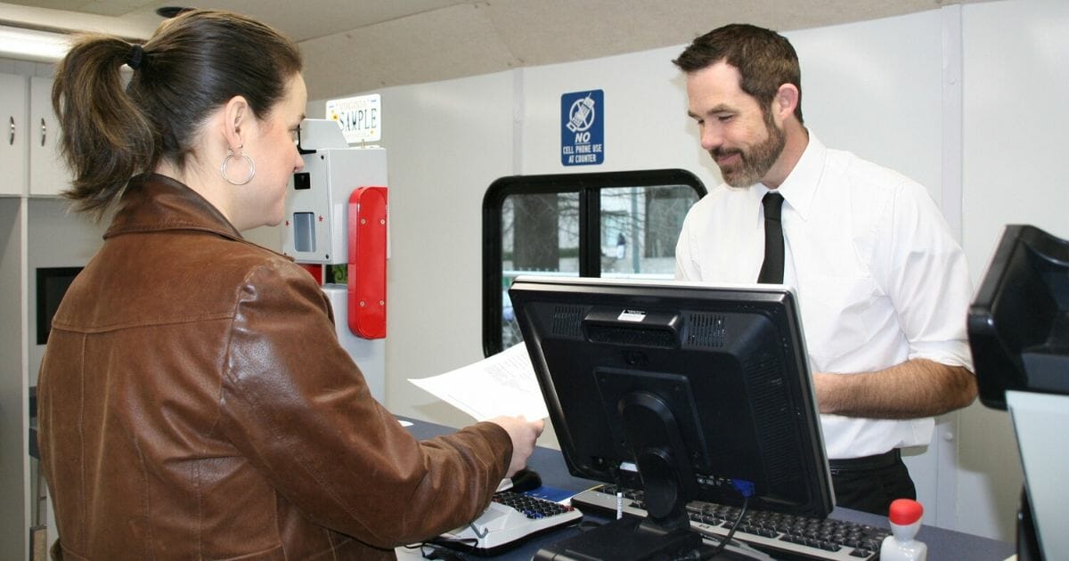 A customer is seen at the Department of Motor Vehicles in the photo above.