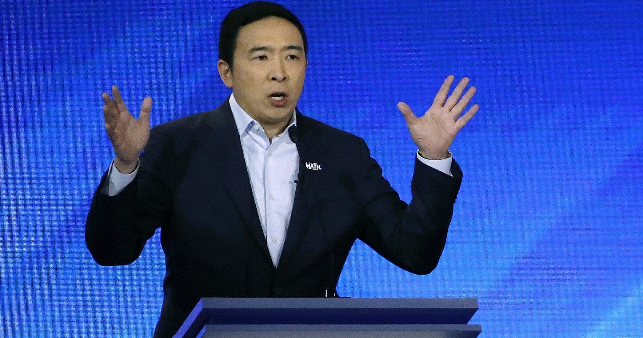 In this Feb. 7, 2020, photo, Democratic presidential candidate entrepreneur Andrew Yang speaks during a Democratic presidential primary debate at Saint Anselm College in Manchester, New Hampshire.