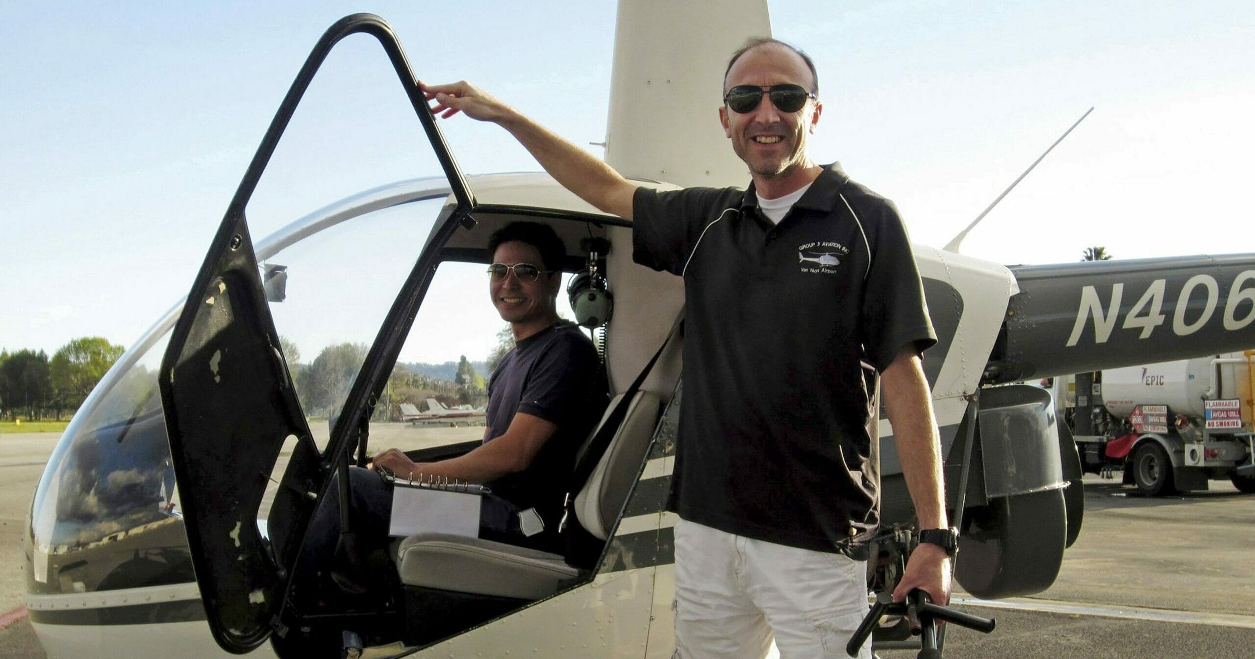 This undated file photo provided by Group 3 Aviation shows helicopter pilot Ara Zobayan standing outside a helicopter, at a location not provided.