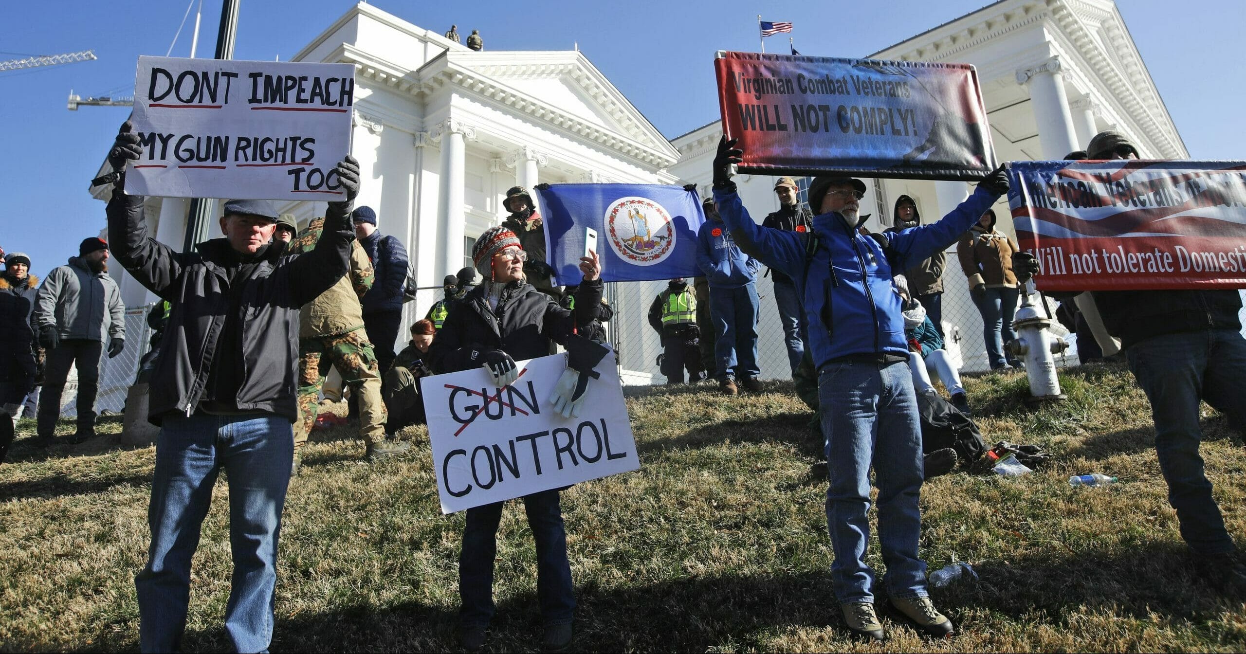 This Jan. 20, 2020, file photo shows pro-gun demonstrators holding signs in front of the Virginia State Capitol in Richmond, Virginia.