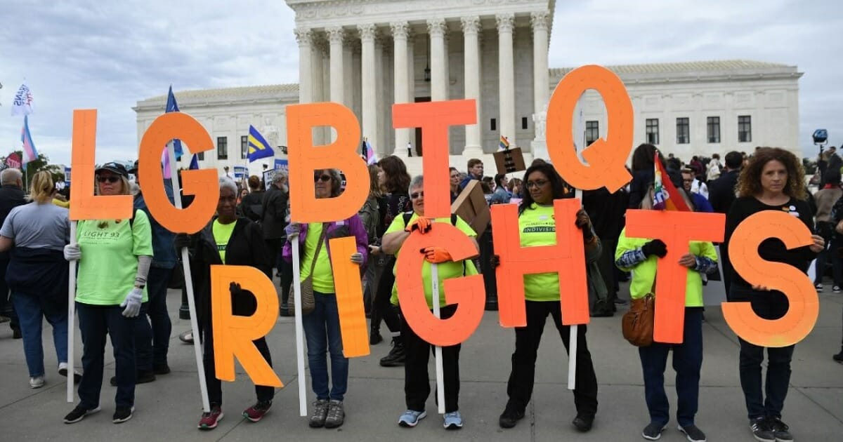 Demonstrators supporting gay and transgender rights rally outside the Supreme Court in Washington in October.