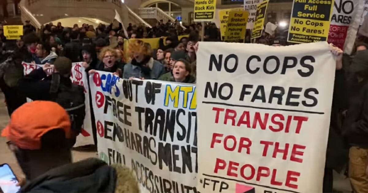 Protesters swarm public transit lines in New York on Friday.