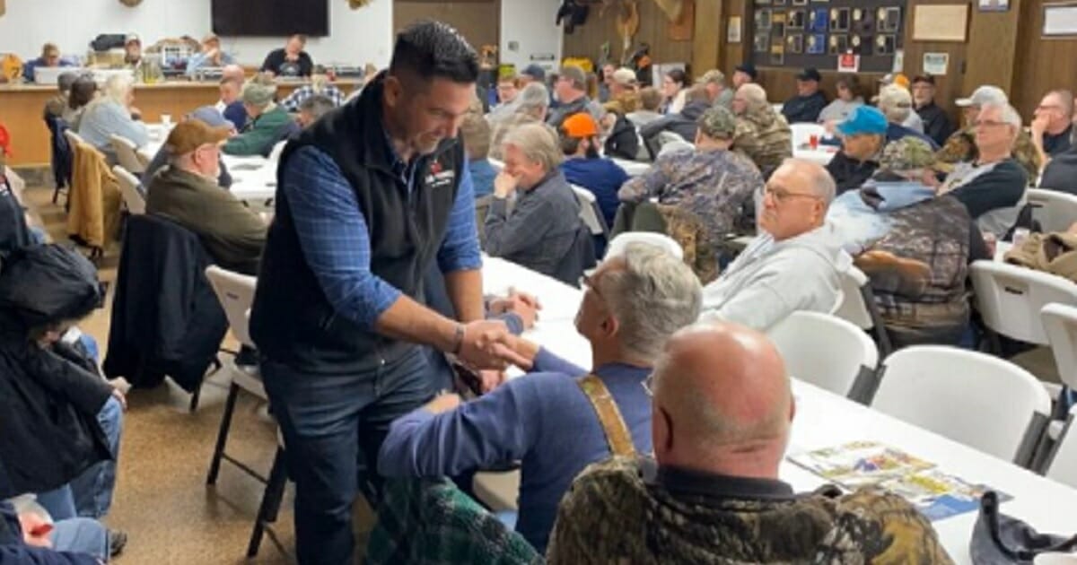 Republican congressional hopeful Sean Parnell greets potential voters in the western Pennsylvania district where he hopes to unseat Democratic Rep. Conor Lamb in November's election.