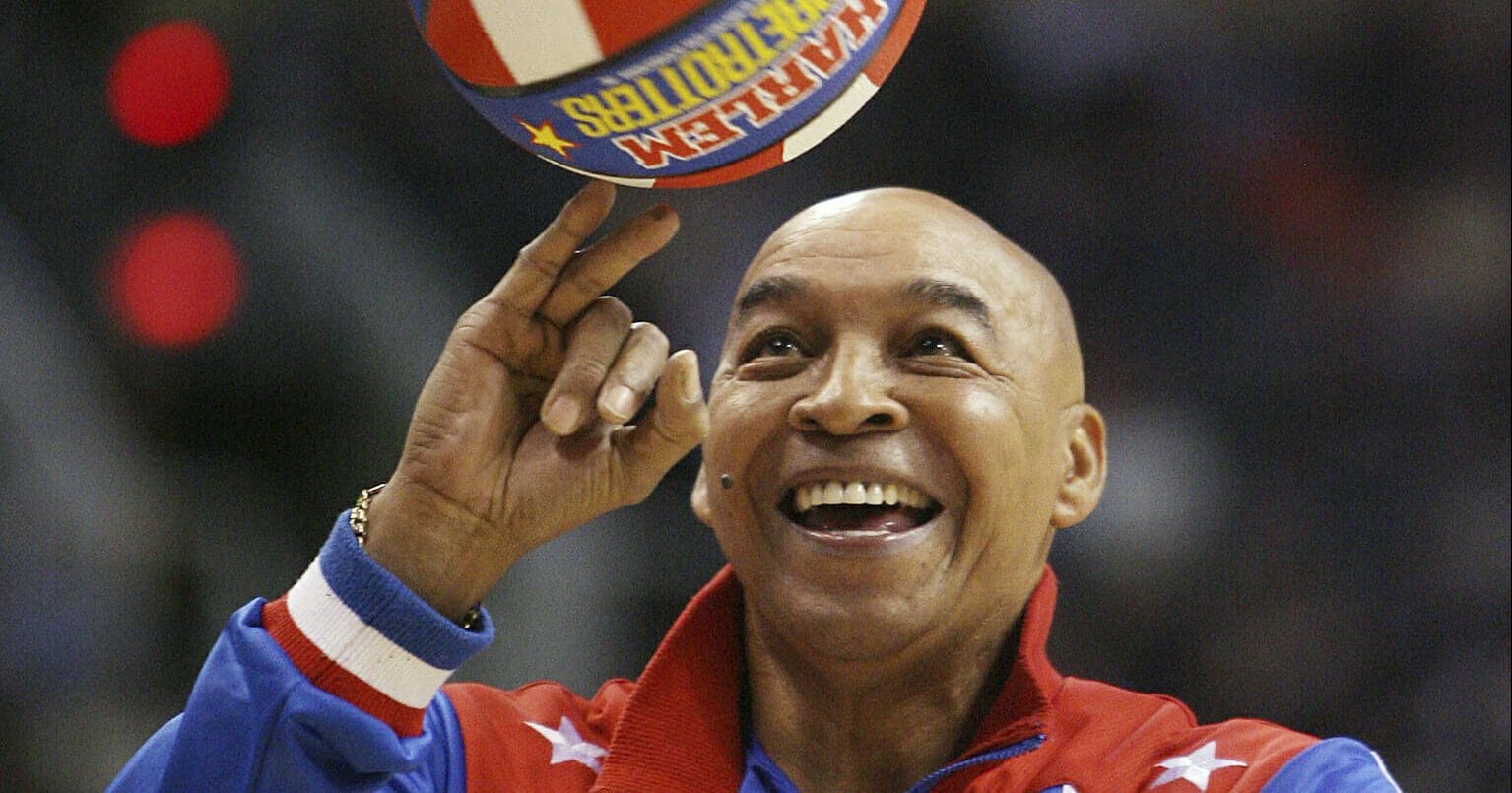 The Harlem Globetrotters' Fred "Curly" Neal performs during a timeout in the second quarter in an NBA game between the Indiana Pacers and the Phoenix Suns on Jan. 9, 2008, in Phoenix.