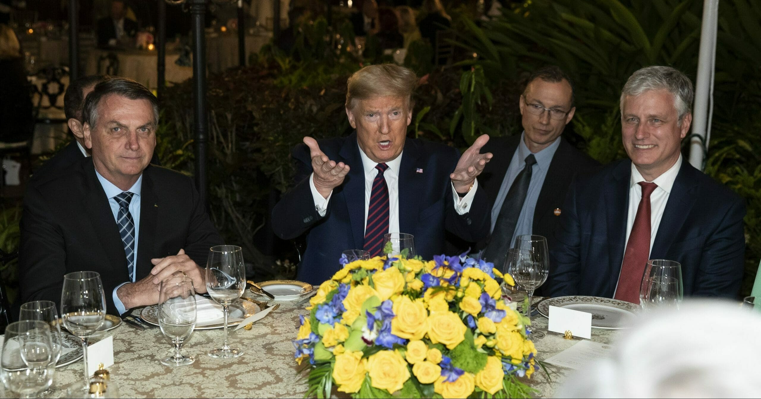 President Donald Trump speaks before a dinner with National Security Advisor Robert O'Brien, right, and Brazilian President Jair Bolsonaro, left, at Mar-a-Lago on March 7, 2020, in Palm Beach, Florida.