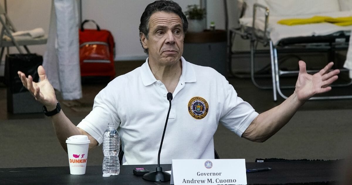New York Gov. Andrew Cuomo gives a daily coronavirus news conference in front of media and National Guard members at the Jacob K. Javits Convention Center, which is being turned into a hospital to help fight coronavirus cases, on March 27, 2020, in New York City.