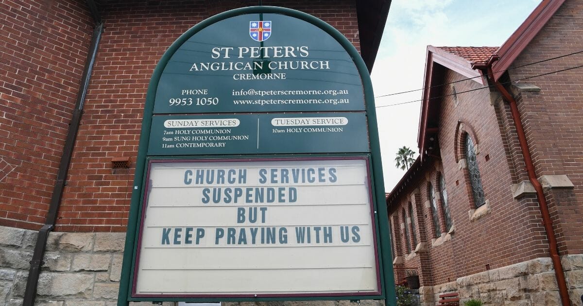 A church in Cremorne with a sign suspending services but urging more prayers on March 25, 2020, in Sydney, Australia.