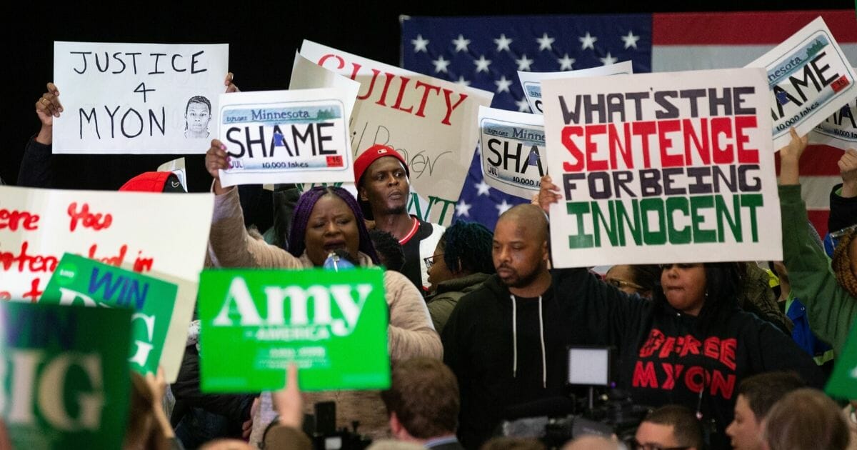 Protesters take over the stage forcing Democratic presidential hopeful Minnesota Sen. Amy Klobuchar to cancel her rally before it even started on March 1, 2020, in St. Louis Park, west of Minneapolis.