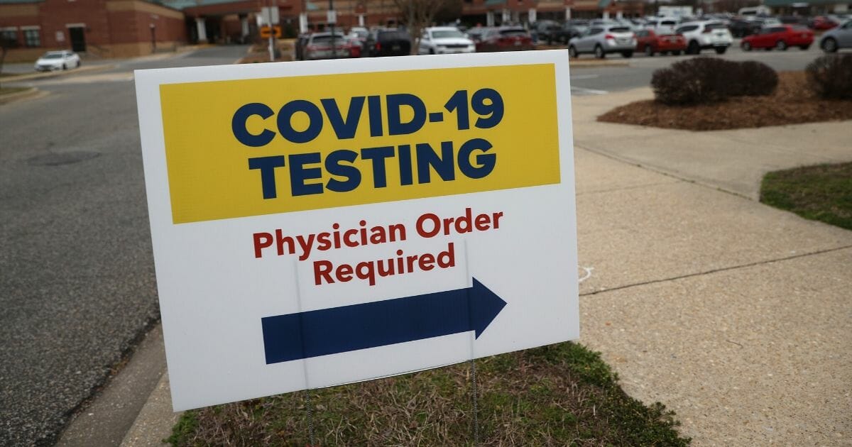 Signs directing patients to a COVID-19 virus testing drive-up location are shown outside Medstar St. Mary's Hospital on March 17, 2020, in Leonardtown, Maryland.