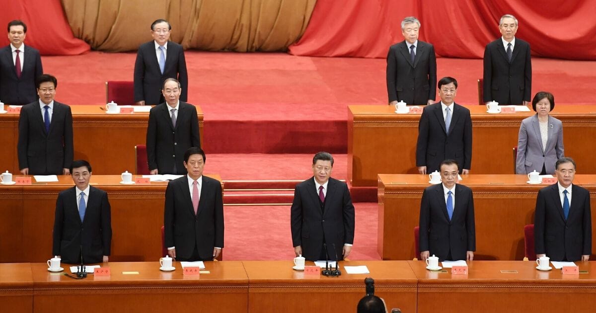 Chinese President Xi Jinping, center, and other Communist Party leaders sing the national anthem in Beijing's Great Hall of the People on April 30, 2019.