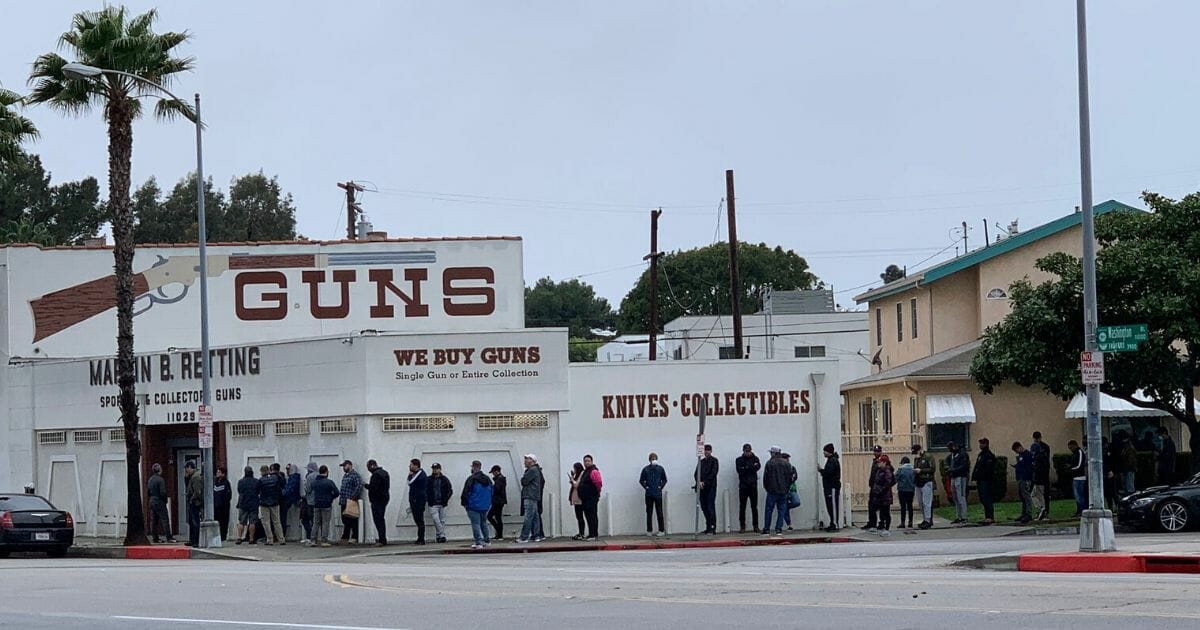 Lines form outside of the Martin B. Retting gun shop in Culver City, in western Los Angeles County, on March 14, 2020.