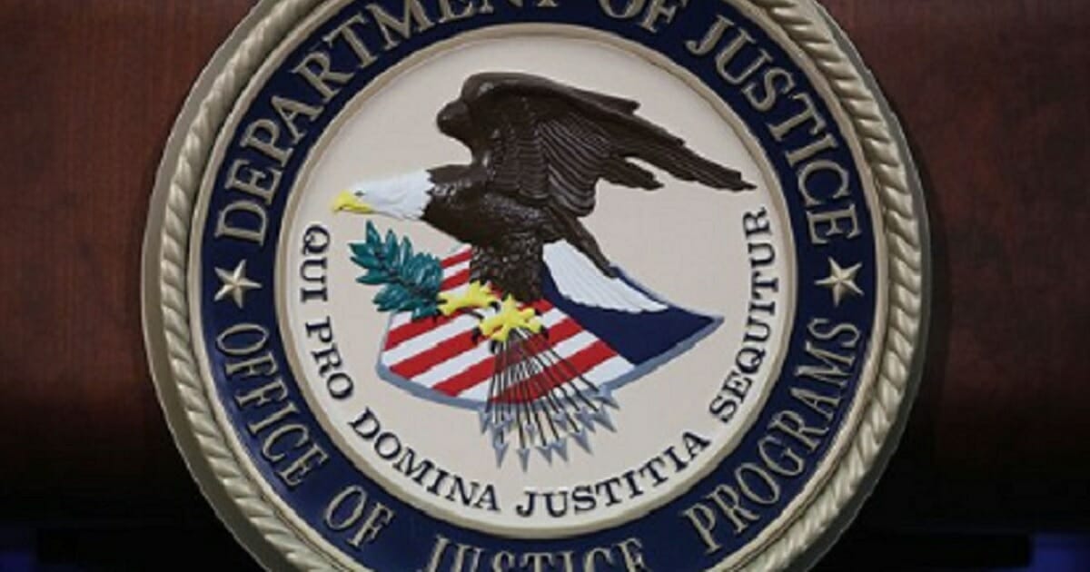 Seal of the United States Justice Department.