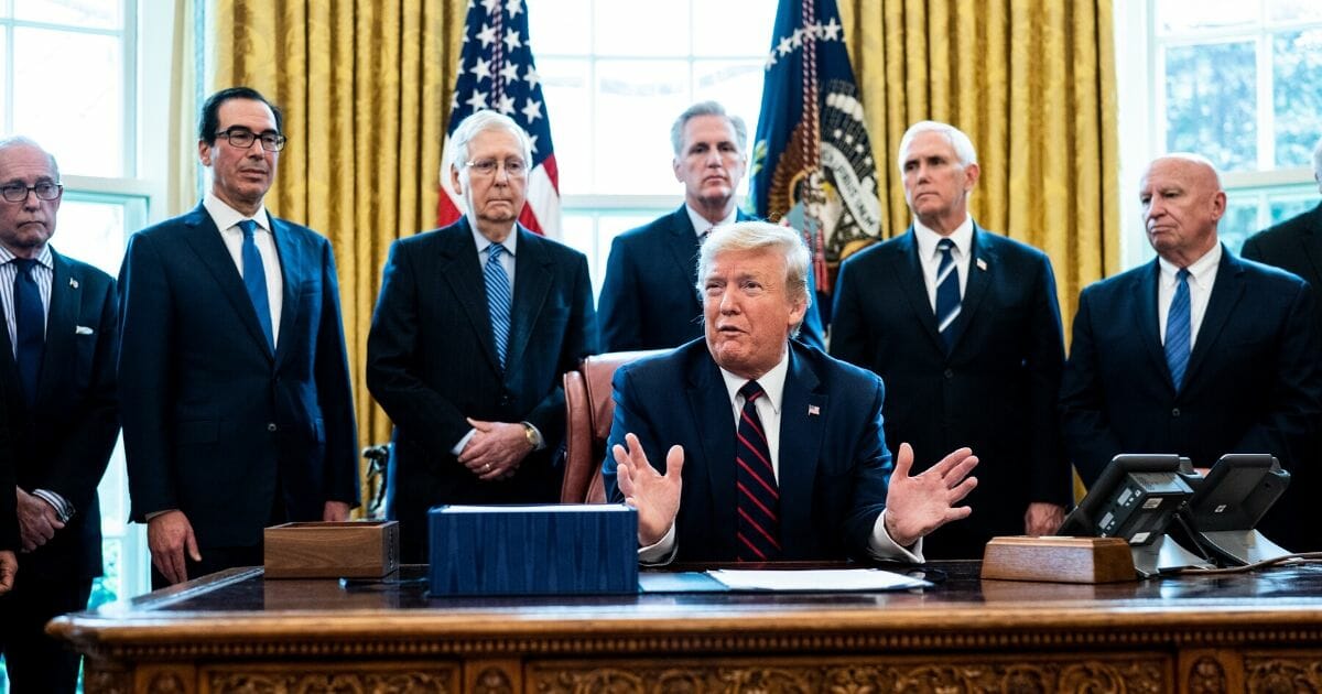 President Donald Trump speaks during a bill signing ceremony for H.R. 748, the CARES Act in the Oval Office of the White House on March 27, 2020, in Washington, D.C.