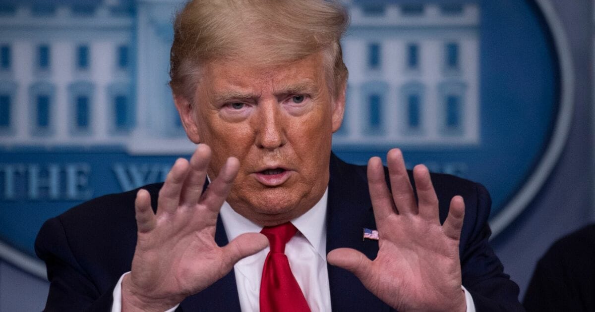 President Donald Trump gestures during a briefing on the coronavirus at the White House on March 22, 2020.