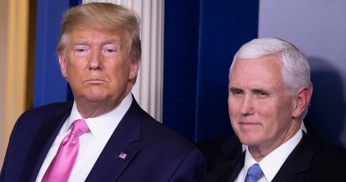 President Donald Trump, right, looks on after a news conference with Vice President Mike Pence in the Brady Press Briefing Room at the White House on Feb. 26, 2020, in Washington, D.C.