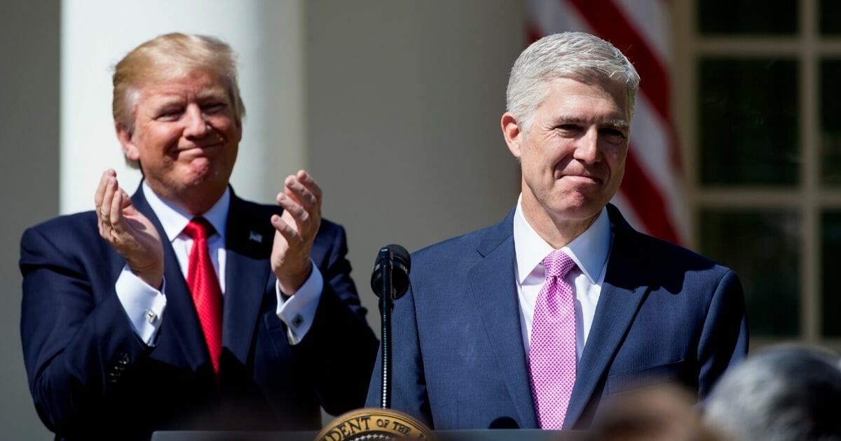 Supreme Court Justice Neil Gorsuch, right, speaks as President Donald Trump looks on during a ceremony in the Rose Garden at the White House April 10, 2017, in Washington, D.C.