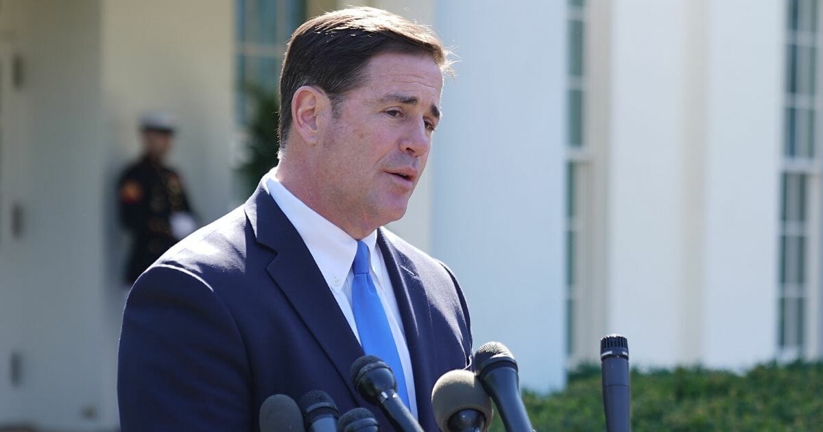 Arizona Gov. Doug Ducey talks to reporters after meeting with President Donald Trump at the White House on April 3, 2019.